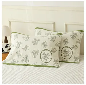 Green floral cotton gauze pillow towel detail shot showing soft fabric and vintage botanical print.