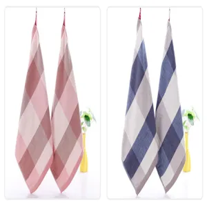 Hanging plaid hand towel detail view, absorbent cotton grid kitchen towel with lanyard.