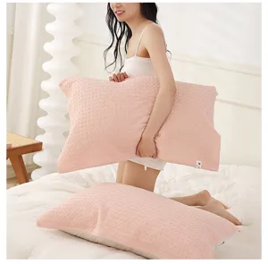 Pink waffle knit pillow cover detail, soft breathable cotton pillowcase for home bedroom use.