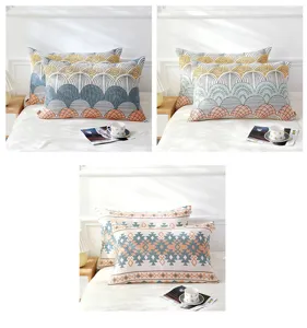 Close-up of breathable cotton gauze pillowcases with geometric patterns on a cozy bed.