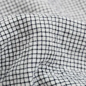 Cotton gauze pillow cover with Japanese minimalist blue and white plaid pattern texture.