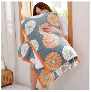 Close-up detail of soft four-layer cotton gauze pillow towel featuring lovely floral patterns.