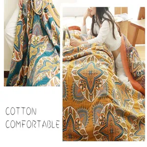 Detail view of five-layer gauze cotton blanket with bohemian pattern for cozy bed use.