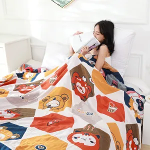 Comfortable 5-layer gauze blanket with cute cartoon prints, breathable soft quilt for bed.