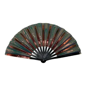 Detailed view of the colorful folding fan, vibrant green and copper stripes, black ribs.