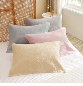 Detailed close-up shot showcasing soft 4-layer gauze cotton pillowcases in assorted colors.