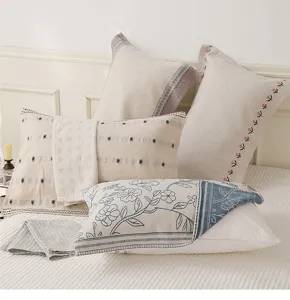 Detailed view of Nordic style cotton linen pillow towels, elegant embroidery and soft fabric texture.