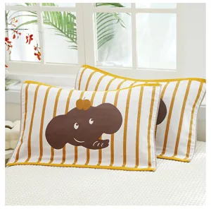 Detailed view of the yellow striped kids gauze pillow towel with cute cartoon elephant pattern.