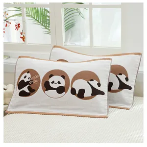 Close-up detail of soft cotton gauze children pillow towel with cute panda pattern design.