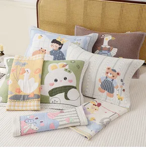 Detailed view of cute cartoon printed gauze pillow towels, soft breathable fabric for home.