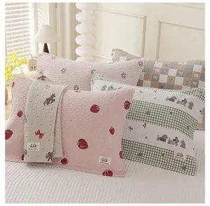 Detailed view of cute cartoon pure cotton quilted pillow towels, soft and skin-friendly home bed linen.