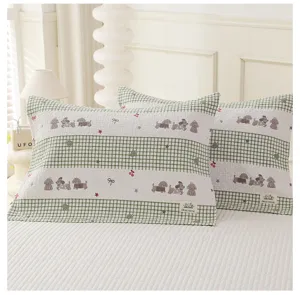Soft cotton plaid pillow towel with cute puppy print, home bedroom bedding textile detail.