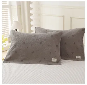 Grey cotton star patterned pillowcase detail view, soft gauze pillow towel for home bedroom use.