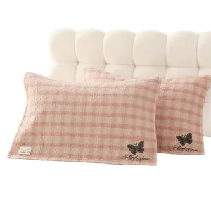 Housses de coussin a rayures en gaze de coton avec broderie papillon pour chambre confortable.