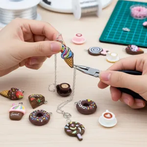 Detailed view of DIY jewelry making with resin food charms and pliers