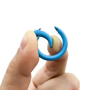 Close-up view of a blue painted spring ring buckle held and opened by fingers for DIY jewelry