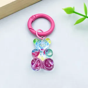 Detailed macro shot of colorful resin bear pendant with pink spring gate ring clasp for DIY