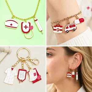 Macro detail view of red and white medical-themed alloy charms for DIY jewelry making.