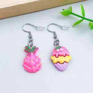 Detail shot of asymmetric cute resin dragon fruit and triple-layer ice cream earrings