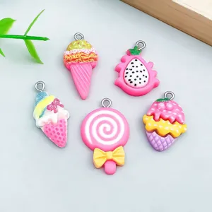 Detailed macro view of cute pink resin ice cream and lollipop charms for handmade DIY crafts