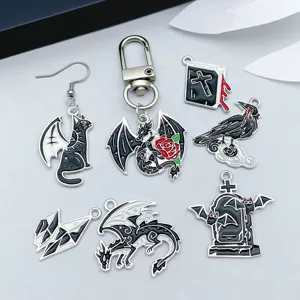 Detailed macro view of various Gothic Halloween enamel charms including dragons and bats