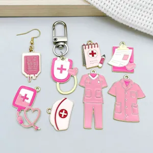 Detail view of pink enamel medical charms featuring nurse uniforms and stethoscopes