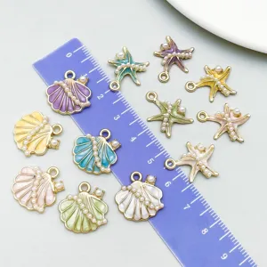 Detailed view of colorful ocean sea star and shell charms with ruler for size