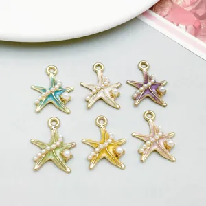 Detail view of colorful enamel starfish charms with pearl accents for DIY jewelry.