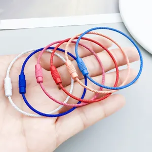 Close-up of colorful spray-painted wire keychains for DIY handmade jewelry crafting
