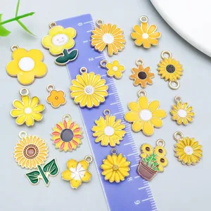 Assortment of 20 yellow enamel daisy and sunflower charms for DIY jewelry creations.