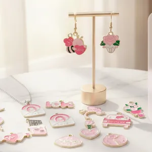 Detailed collection of pink enamel Valentine's Day charms featuring heart and rose DIY designs