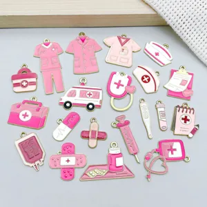 Macro view of twenty mixed pink enamel medical charms for handmade DIY jewelry making