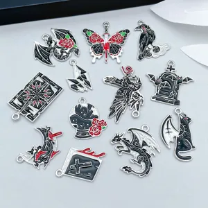 Detailed macro view of 12 mixed dark gothic Halloween alloy enamel pendants for DIY jewelry