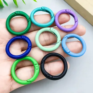 Detailed macro view of vibrant colorful painted spring o-ring buckles for DIY jewelry making