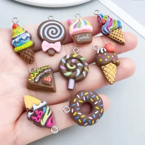 Detailed view of assorted brown resin food charms including donuts and lollipops for DIY.