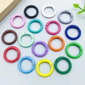 Colorful painted spring buckles in various shades for DIY jewelry and keychain accessories.