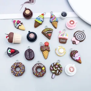 Macro shot of mixed resin food pendants including donuts and coffee cups for DIY jewelry making.