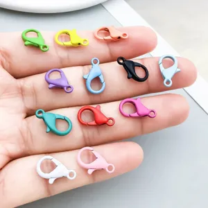 A close-up view showing various colorful painted alloy lobster clasps for DIY jewelry making