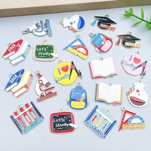 Variety of colorful school-themed enamel charms for graduation DIY jewelry making and crafts