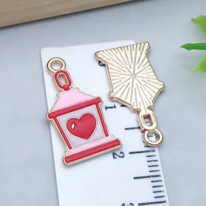 Detailed view of a heart lantern alloy pendant with oil-drop enamel for DIY jewelry making