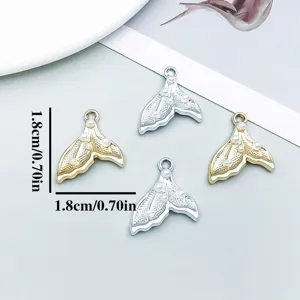 Detail of 1.8cm mermaid tail charms with pearls in gold and silver for jewelry