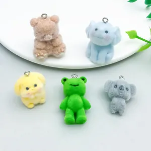 Detailed macro shot of colorful flocked resin animal charms for DIY jewelry making accessories
