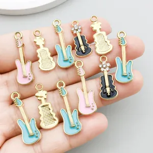 Detailed macro view of colorful enamel guitar and violin charms for DIY jewelry making
