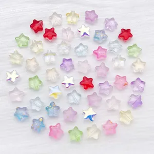 Macro shot of colorful transparent star beads with gold foil for DIY jewelry making