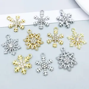 Detailed view of mixed gold and silver rhinestone snowflake pendants for DIY jewelry making.