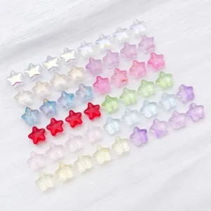 Macro view of colorful translucent star-shaped glass beads with gold foil for DIY jewelry making