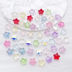 Macro view of colorful star-shaped transparent beads with elegant gold glitter detail