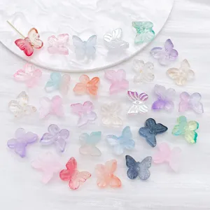 Close-up of assorted colorful gradient butterfly-shaped glass beads for DIY jewelry designs