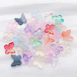 Macro shot of 30pcs gradient butterfly glass beads for DIY bracelet and necklace making.