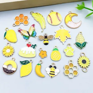 Detailed view of 20 assorted yellow enamel alloy charms for DIY jewelry making kits